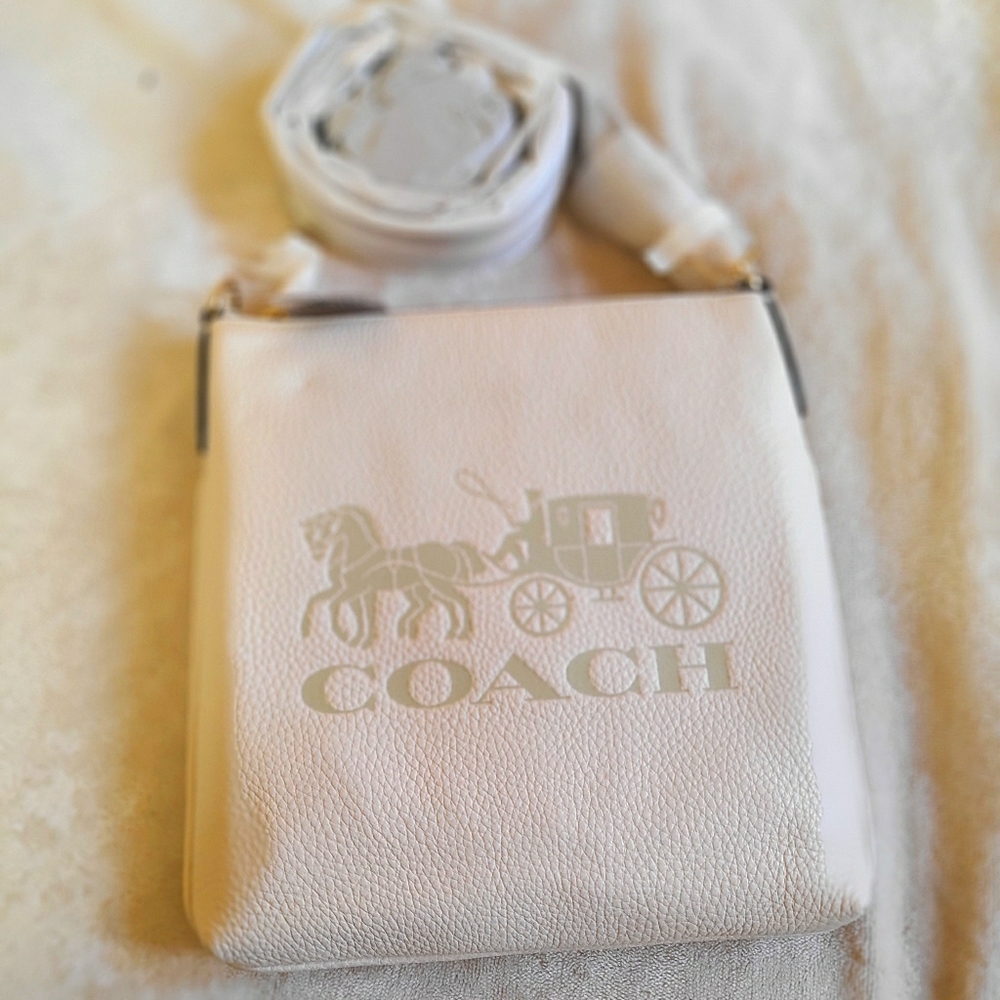 Coach crossbody with horse and carriage